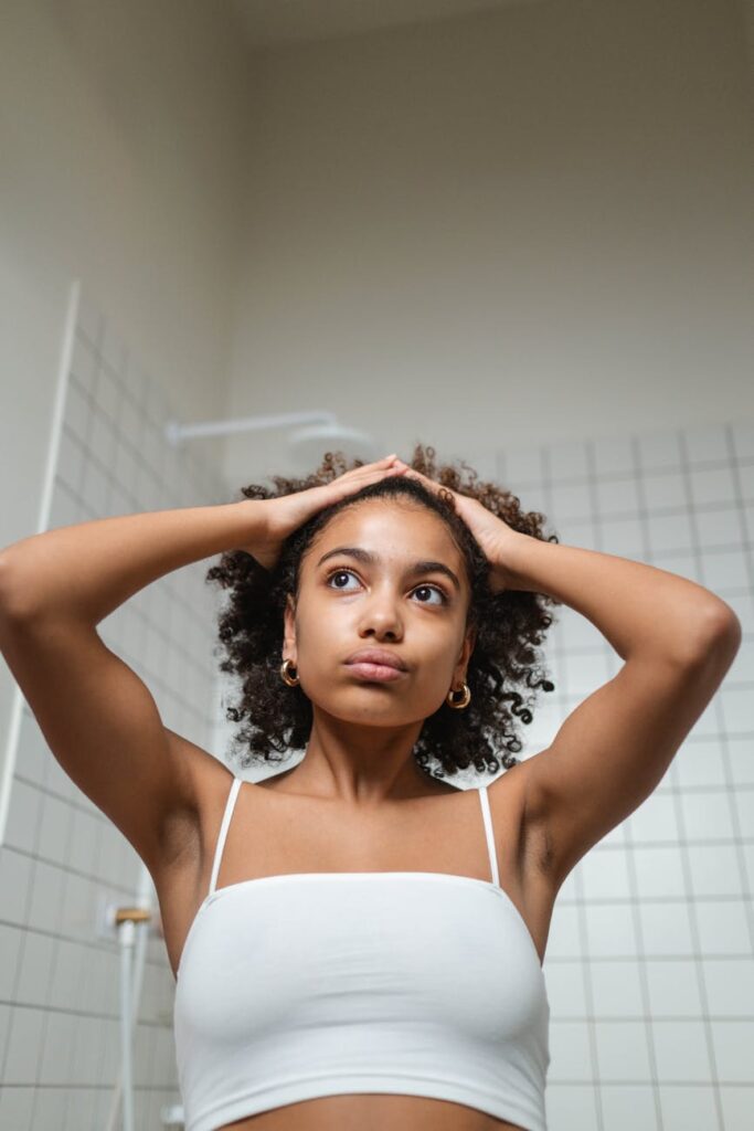 woman wearing a white spaghetti strap top